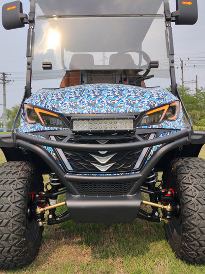 Front view of an off-road golf cart with a blue camouflage pattern on the hood.