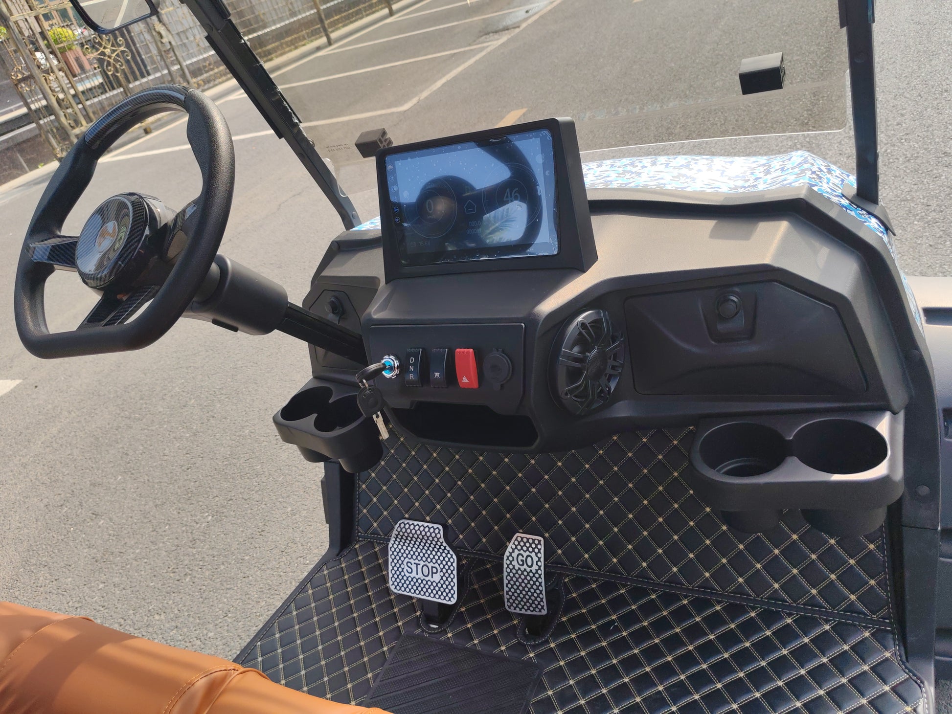smart golf cart interior with steering wheel and LED dashboard view
